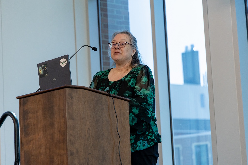 Woman speaking from behind a lectern