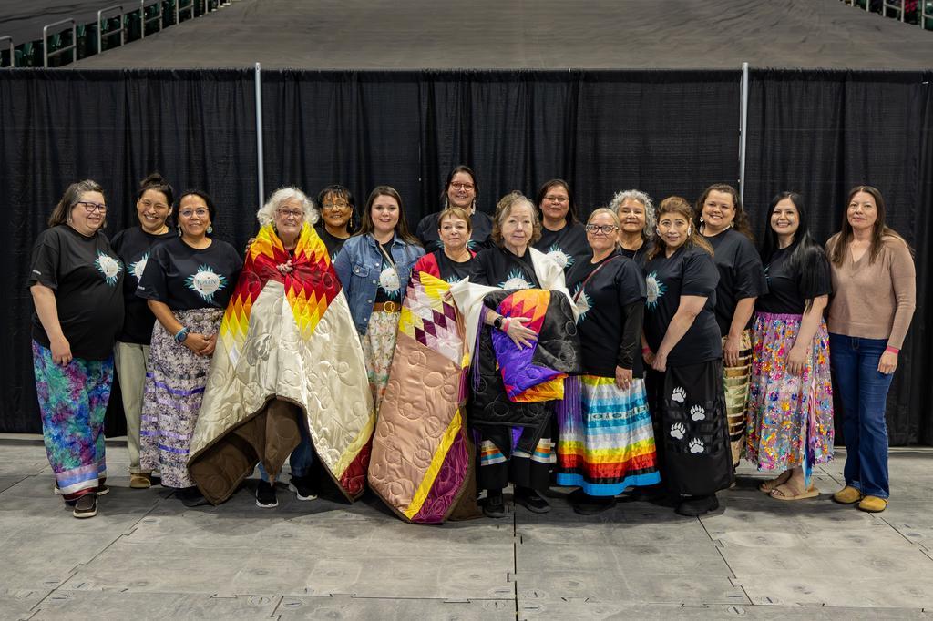 Rain staff and alumni at powow