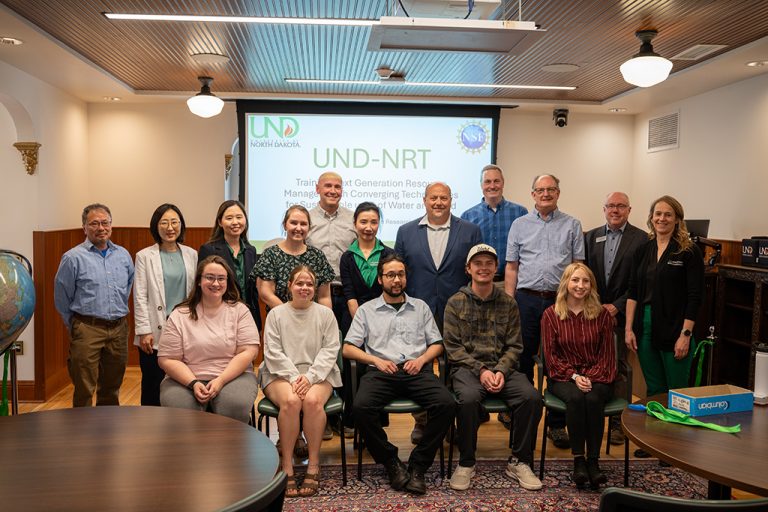 UND faculty members and graduate students take a group photo in the Gershman Graduate Center