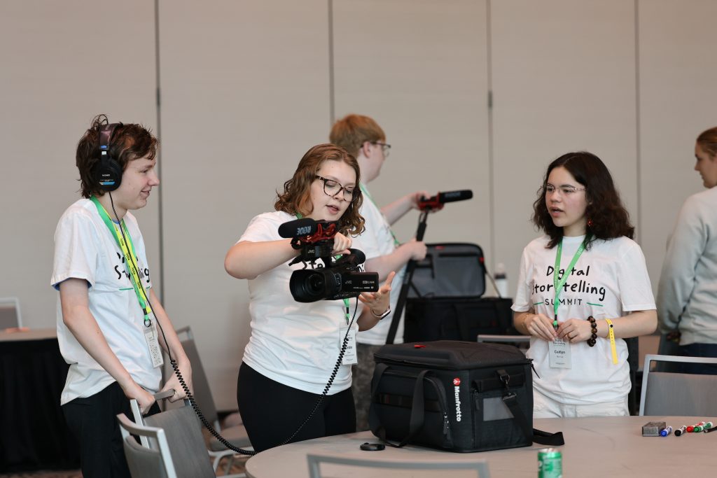 Students learn to operate video and audio equipment during the summit.