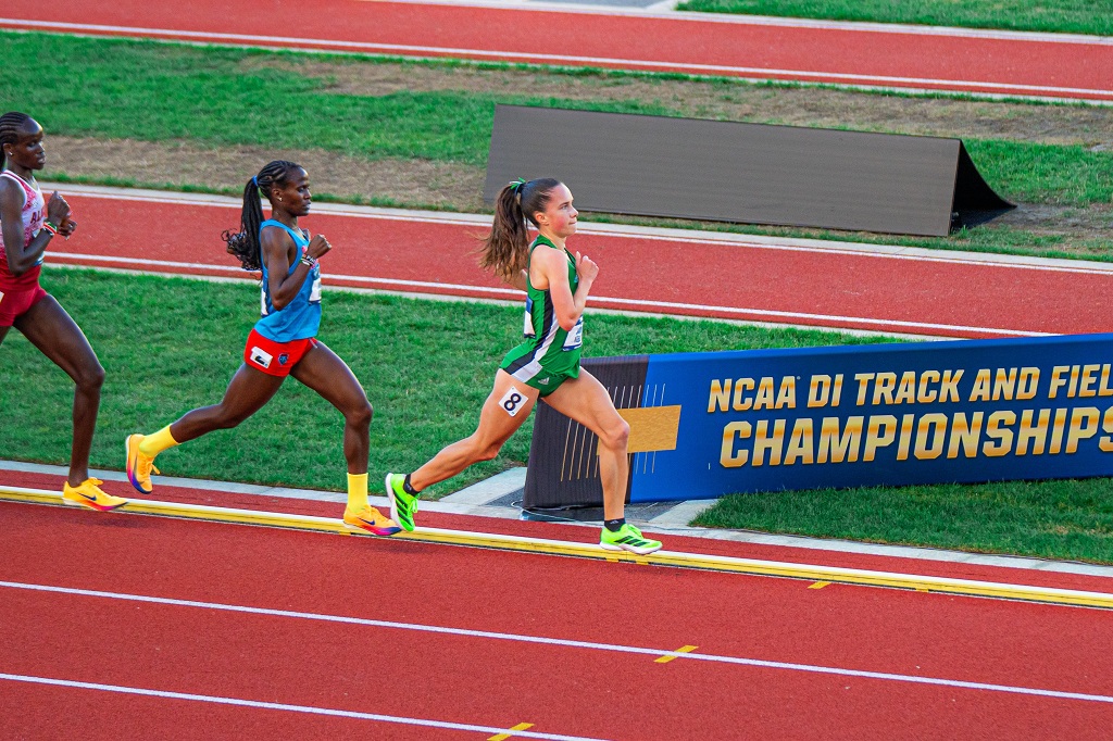 Runners cometing in women's race at NCAA Outdoor Track & Field Championships.