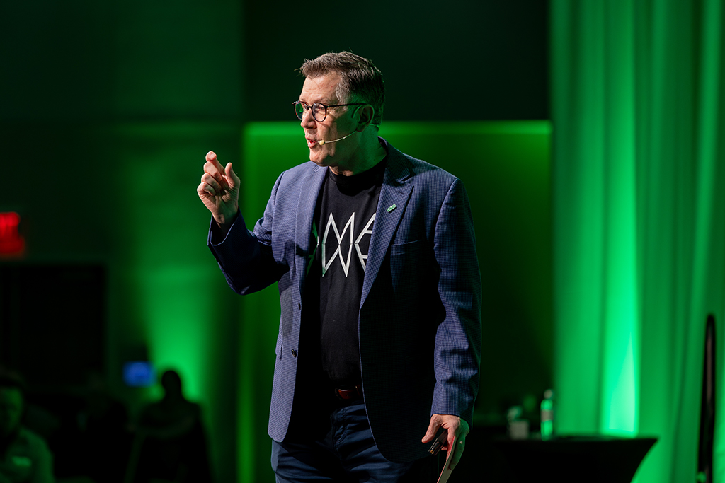 Andy Armacost on stage at Wake Up To UND 2026